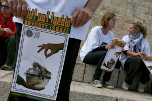 Foreign peace activists holds posters calling to boycott Israel during a protest outside the Damascus Gate in Jerusalem s Old City March 30, 2009. Photo by Olivier Fitoussi /FLASH90 *** Local Caption *** ????? ???? ??? ?? ?????